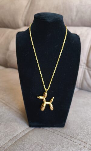 colgante perrito dorado